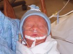 Andrew needed a feeding tube until he could nurse well.  He didn't like it, and had a habbit of pulling it out, thus the excessive taping.