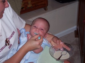 Mon Aug 29 20:12:22 2005

Andrew had his 4-month pediatric visit today where he received his 4-month immunization injections.  He weighed 15 lbs. and 2 oz. today, and also took his first food with a spoon -- ground rice mixed with baby formula.