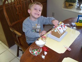 Mon 22 Dec 2008 03:07:34 PM

Andrew and Mom decorated the gingerbread house from Breland and Vana.