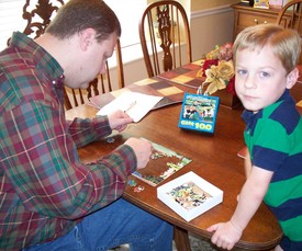 Sun 28 Mar 2010 11:51:24 AM

Dad and Andrew work on a new puzzle that Aunt Renee' gave to Andrew -- 100 pieces!