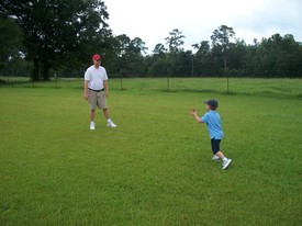 Mon 02 Aug 2010 02:14:21 PM

Andrew and dad toss a football at Grandaddy's house.