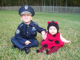 Sat 31 Oct 2009 05:51:07 PM

Andrew and Gracie at Halloween -- Andrew was a policeman and Gracie a lady bug.