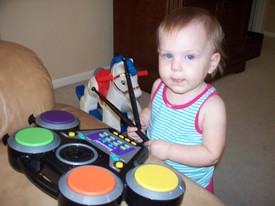 Fri 25 Jun 2010 02:49:25 PM

Gracie plays Andrew's toy drums.